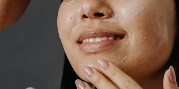 Women doing Chemical exfoliation on oily skin in winter