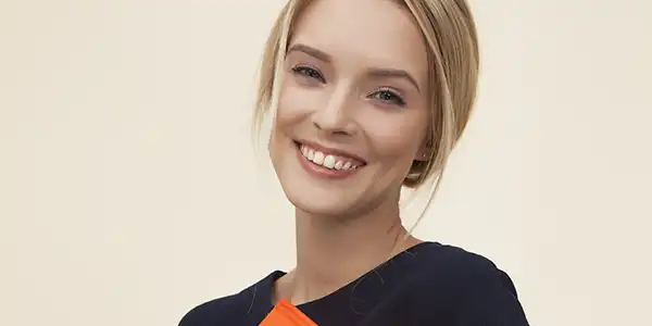 smiling woman wearing a black sweater