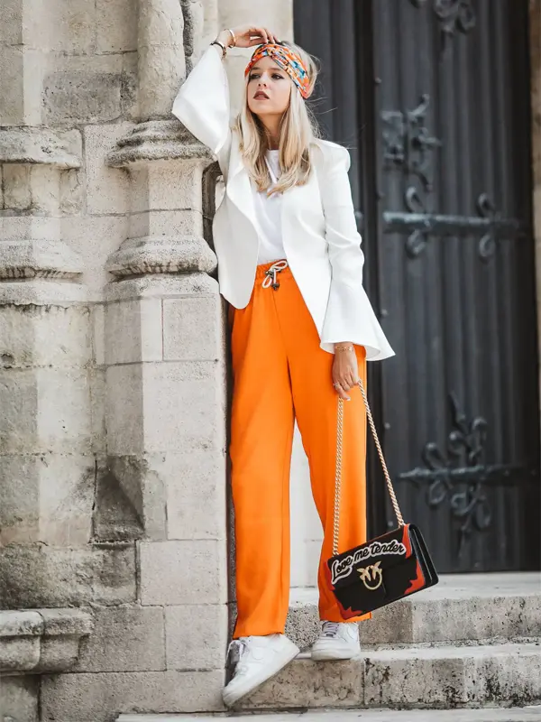 orange palazzo pants with white blazer