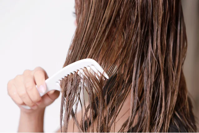 a women combing wet hair