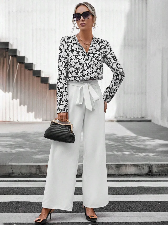 a woman in a cute floral print top with wide-leg pants