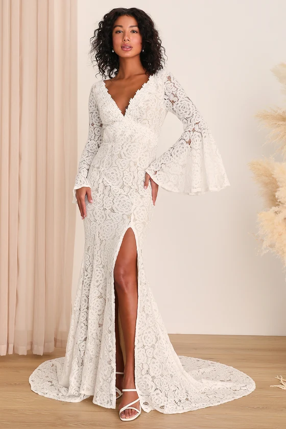 Woman in Elegant White Lace Wedding Dress with Bell Sleeves and Slit