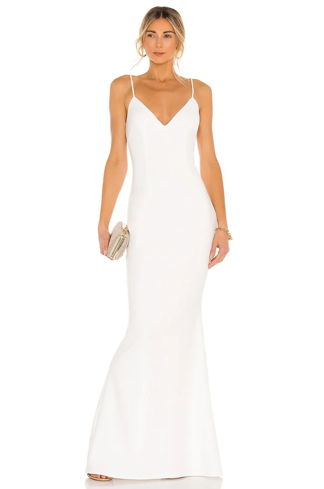 Bride in a budget-friendly, form-fitting white dress with thin straps and a V-neckline