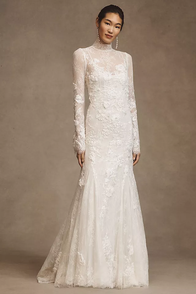 Elegant white lace mermaid wedding gown with long sleeves