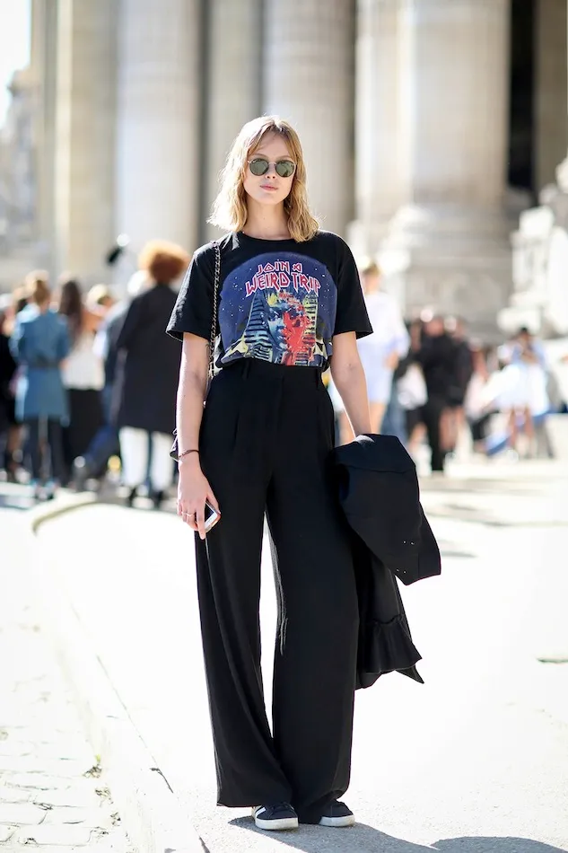 a woman in black pants and a t-shirt