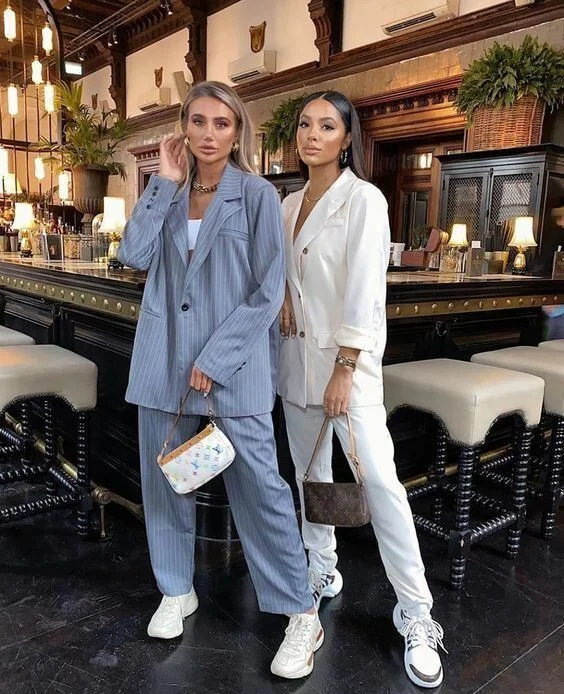 two women in suit paired with fresh sneakers